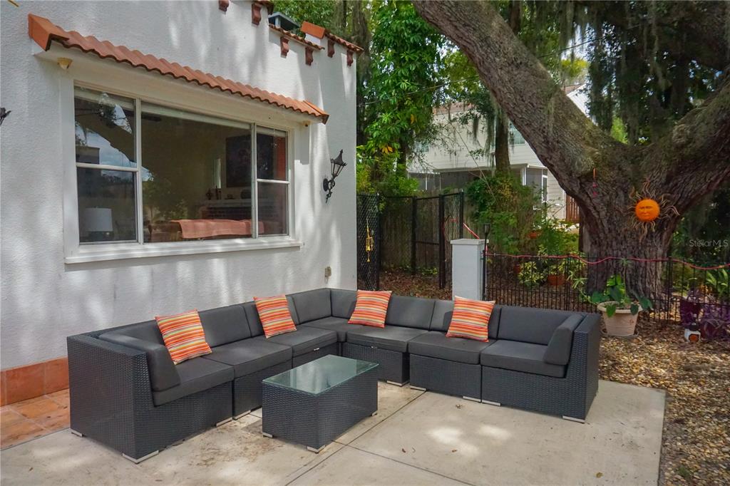 229 East 6th Avenue Mount Dora, FL 32757 - Photo 26 of 65 a outdoor living space with patio furniture and a potted plant
