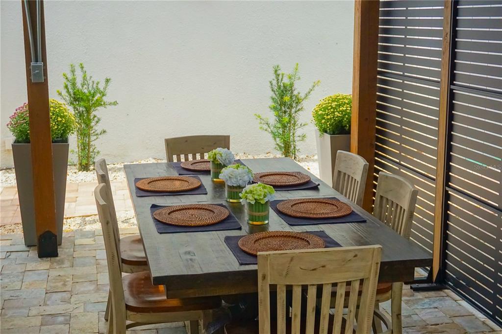 229 East 6th Avenue Mount Dora, FL 32757 - Photo 28 of 65 a view of a dining room with furniture and potted plant