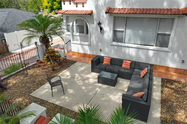 a view of a chairs and table in the patio