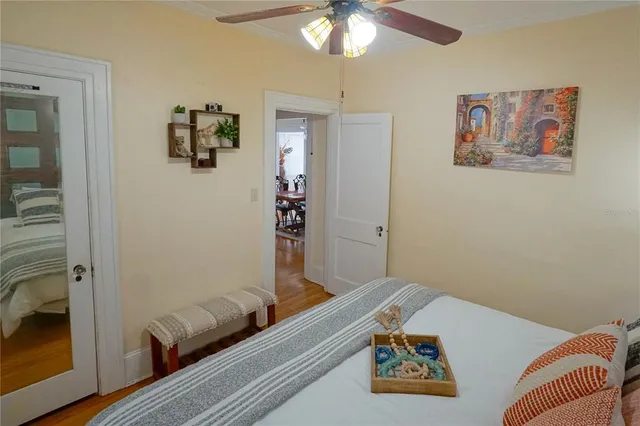 a view of a patio with table and chairs and potted plants