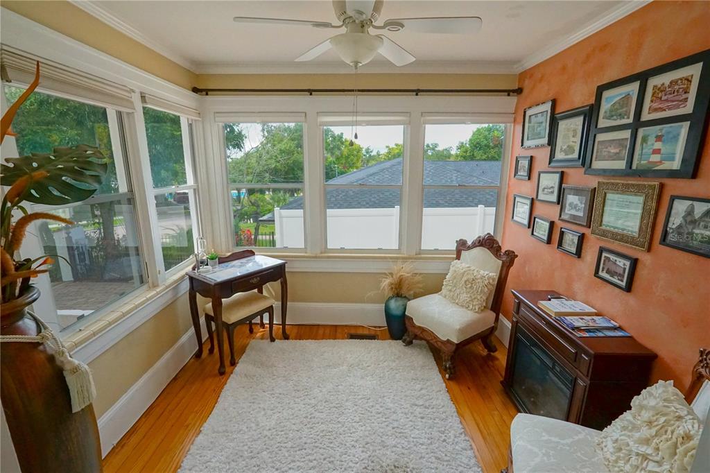 229 East 6th Avenue Mount Dora, FL 32757 - Photo 5 of 65 a living room with furniture and a large window