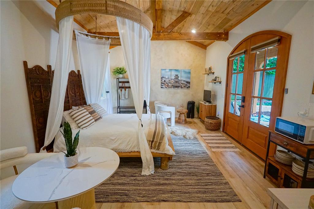 229 East 6th Avenue Mount Dora, FL 32757 - Photo 60 of 65 a dining room with furniture and wooden floor