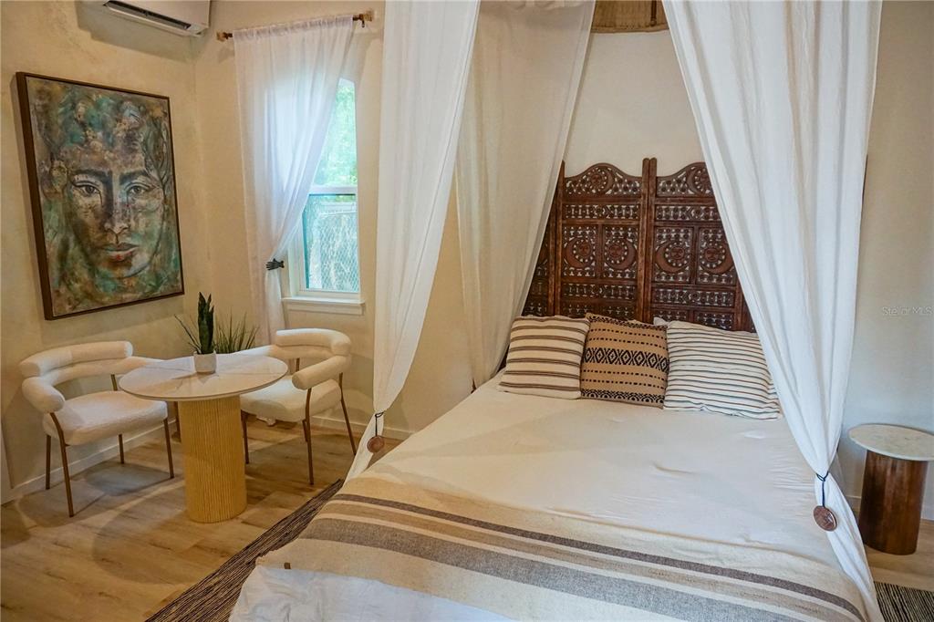 229 East 6th Avenue Mount Dora, FL 32757 - Photo 64 of 65 a view of a balcony with furniture and floor to ceiling window