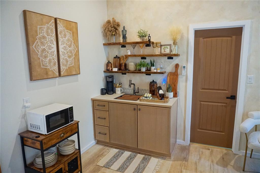 229 East 6th Avenue Mount Dora, FL 32757 - Photo 65 of 65 a kitchen with stainless steel appliances a refrigerator and cabinets