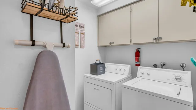 a utility room with dryer and washer