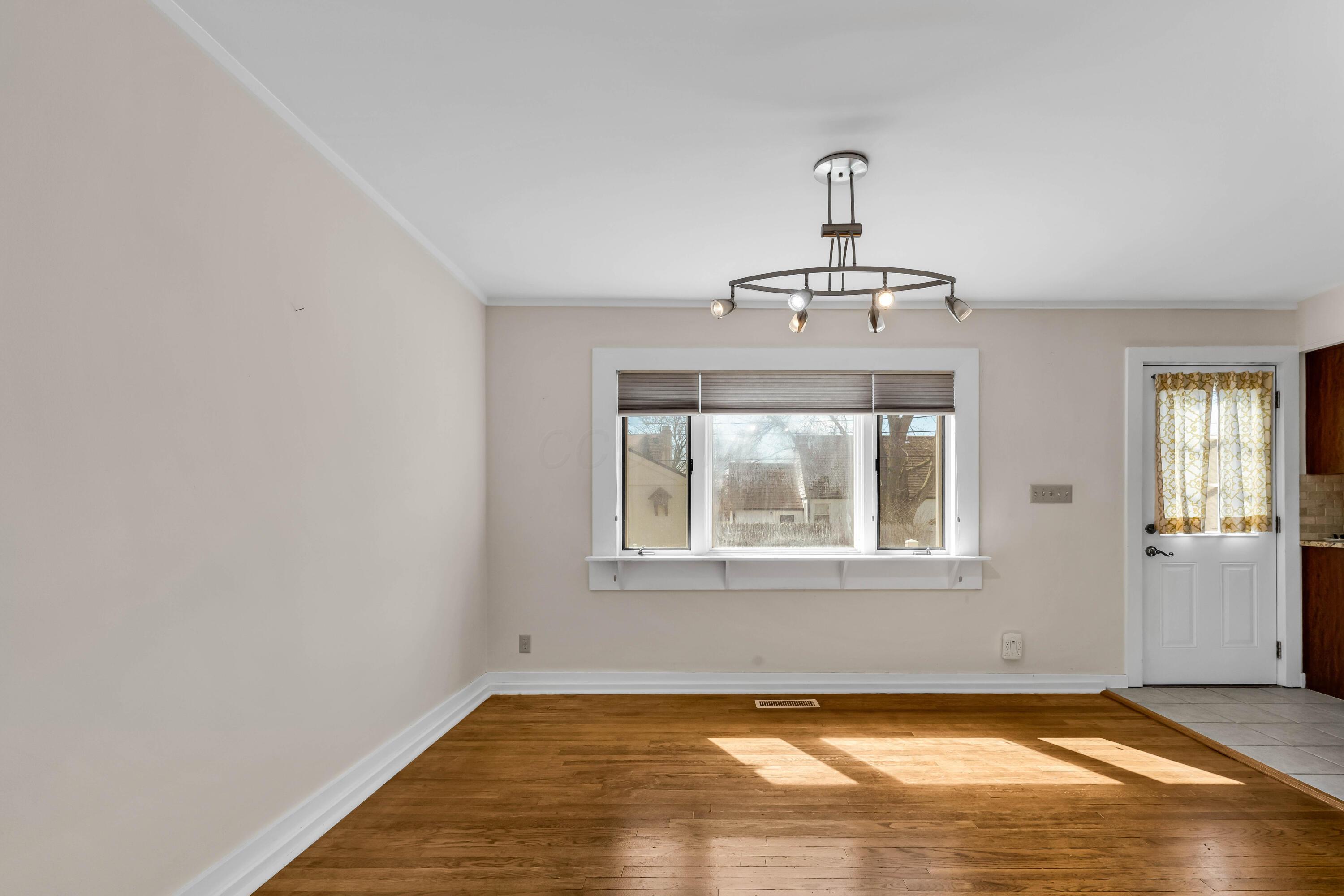2033 Zollinger Road Columbus, OH 43221 - Photo 12 of 44 • Hardwood flooring
• Ivory painted walls
• Chandelier