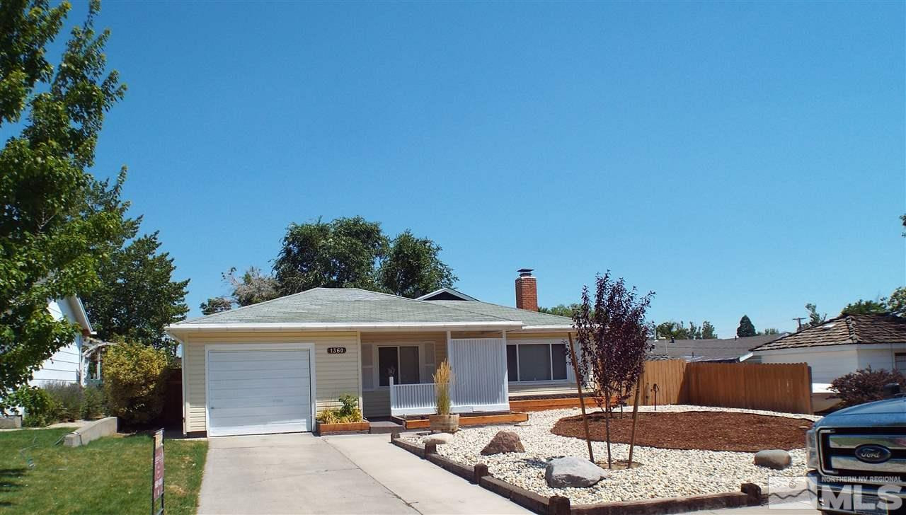1360 Princess Avenue Reno, NV 89502 - Photo 1 of 1 a front view of a house with a yard