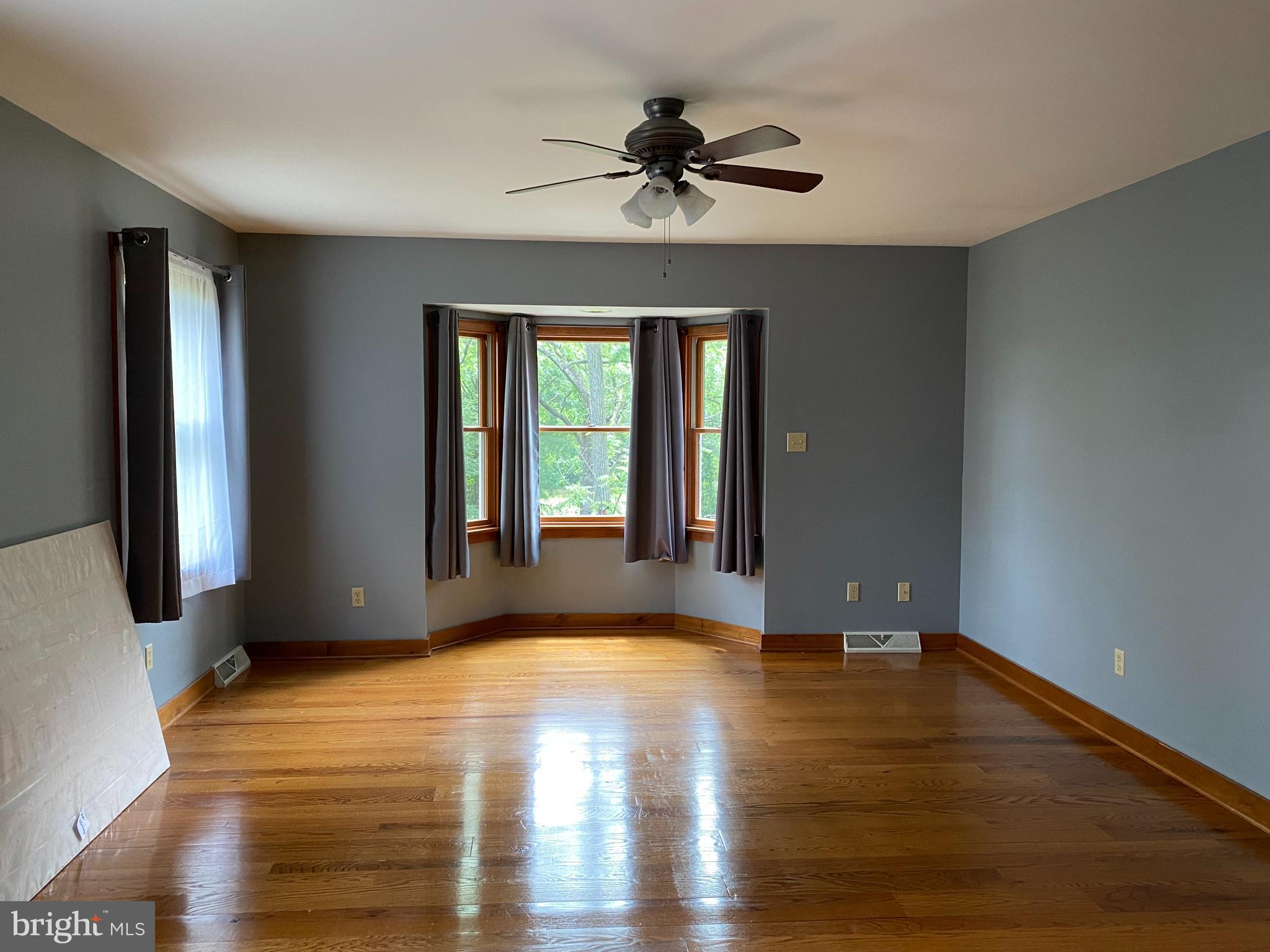 1909 Back Mountain Road Winchester, VA 22602 - Photo 12 of 28 a view of an empty room with window and wooden floor
