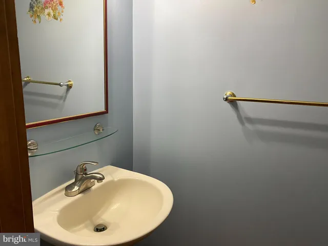 a bathroom with a sink and mirror