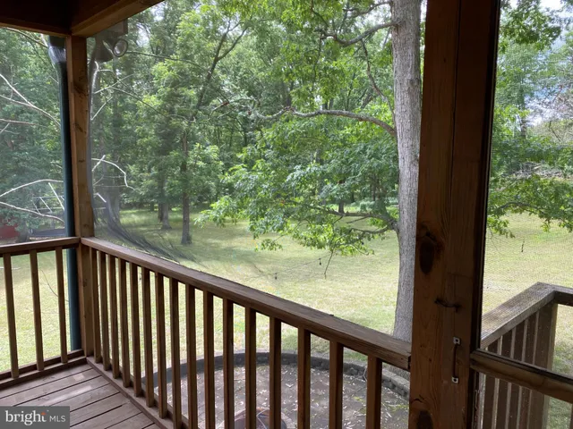 a view of balcony with wooden floor