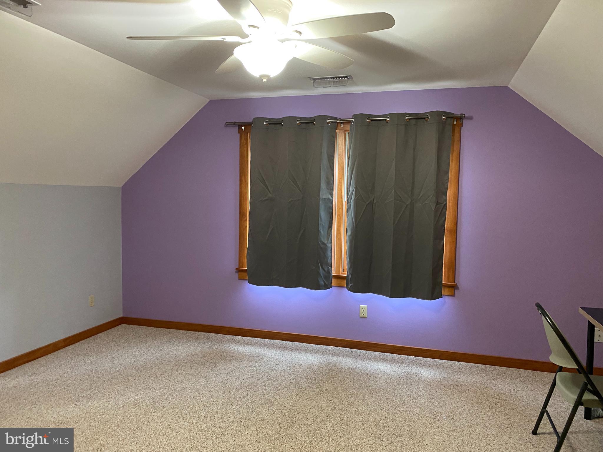 1909 Back Mountain Road Winchester, VA 22602 - Photo 22 of 28 an empty room with windows and fan