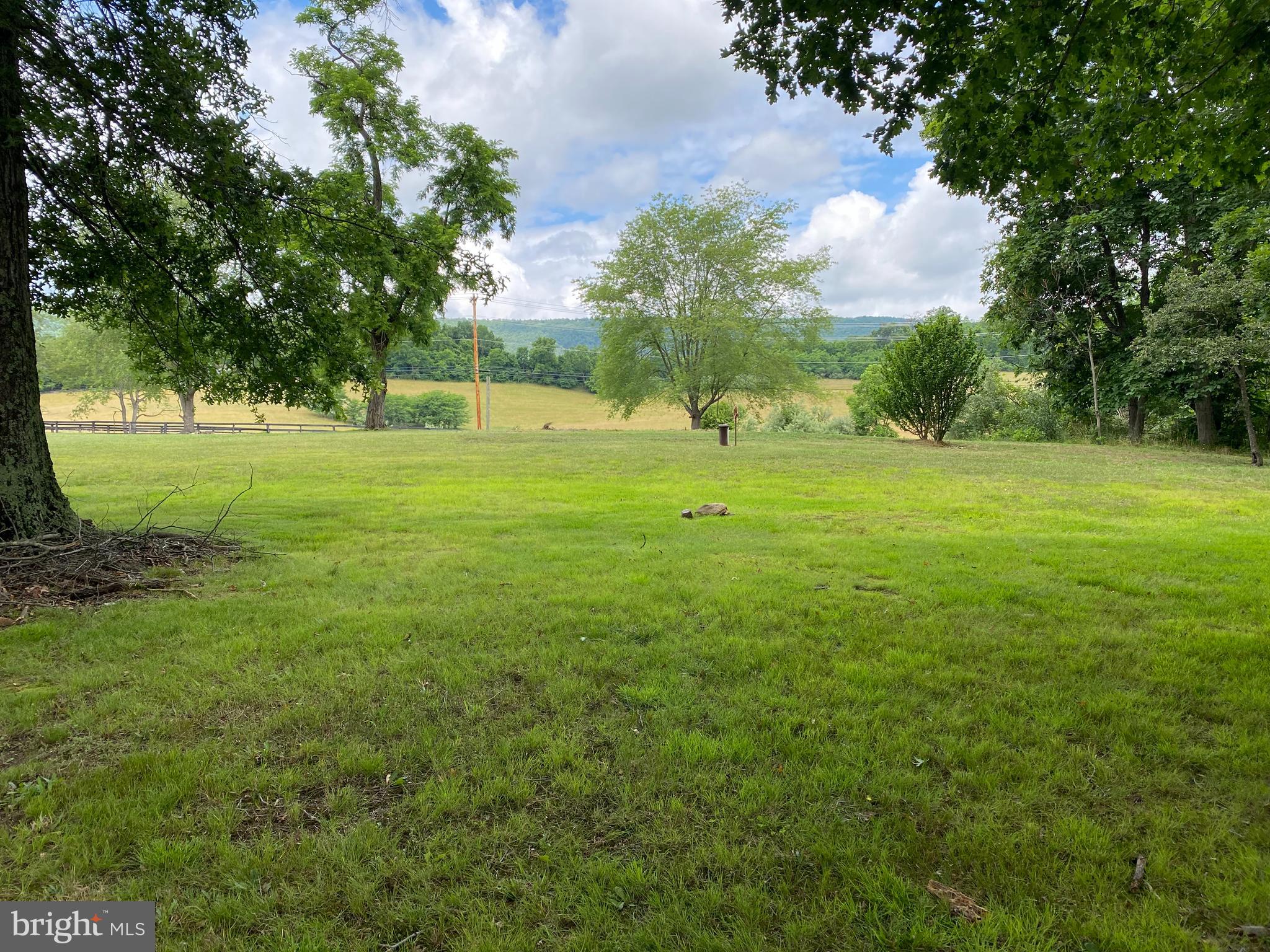 1909 Back Mountain Road Winchester, VA 22602 - Photo 5 of 28 a view of field with trees in the background