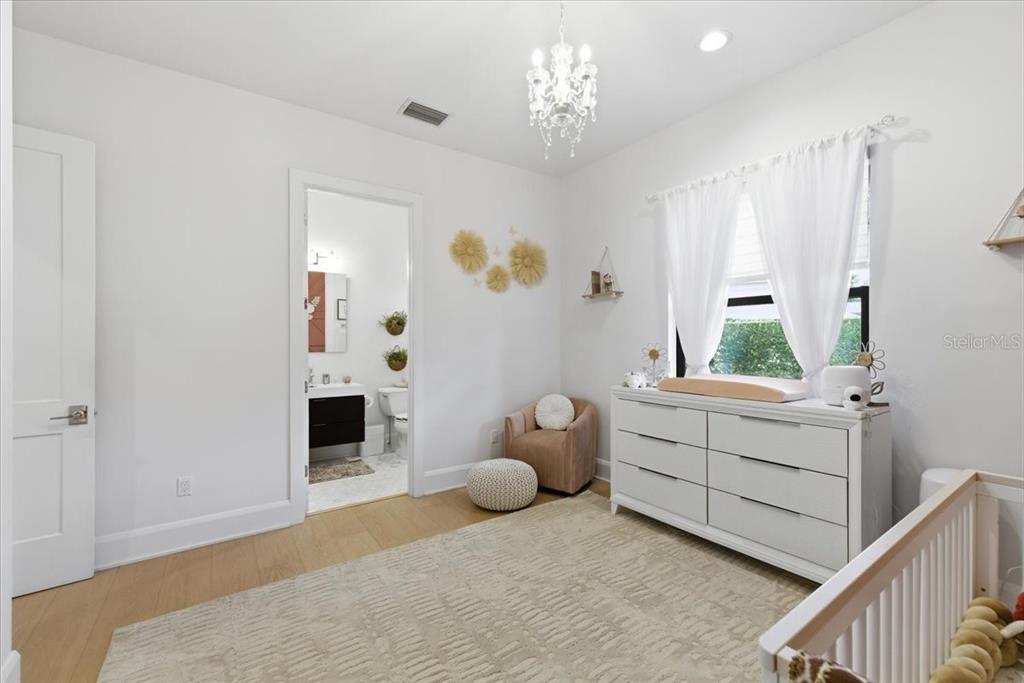 2829 Coastal Range Way Lutz, FL 33559 - Photo 49 of 64 a spacious bedroom with a bed and a window