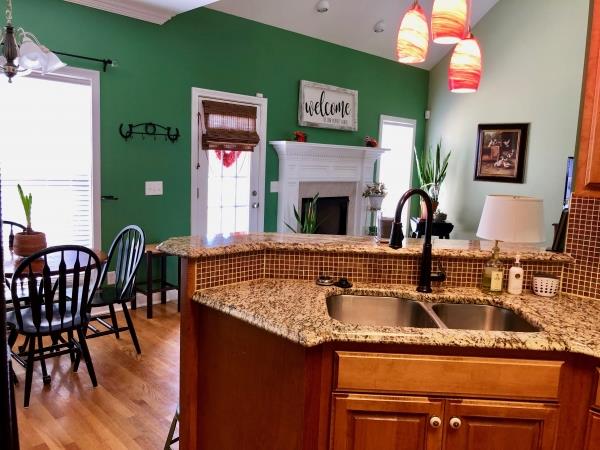 702 Heritage Road Lebanon, TN 37087 - Photo 14 of 25 a kitchen with a sink a counter space and dining table