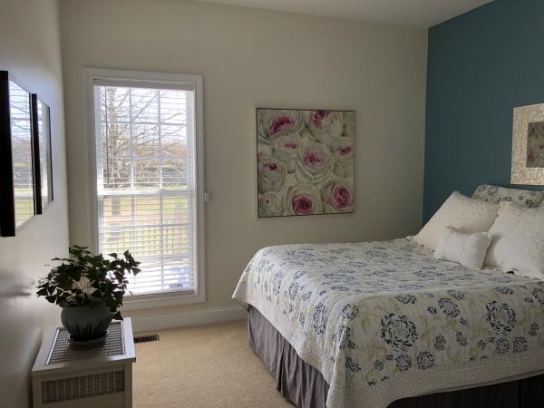 702 Heritage Road Lebanon, TN 37087 - Photo 17 of 25 a bedroom with a bed and a potted plant