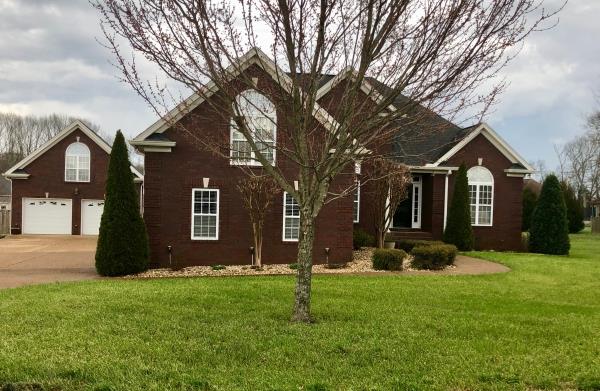 702 Heritage Road Lebanon, TN 37087 - Photo 4 of 25 a front view of a house with a yard