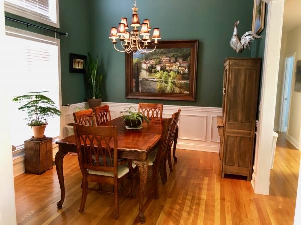702 Heritage Road Lebanon, TN 37087 - Photo 9 of 25 a dining room with furniture potted plants and wooden floor