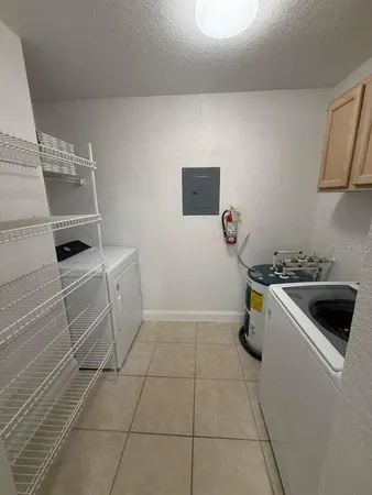 a kitchen with a sink and a stove top oven