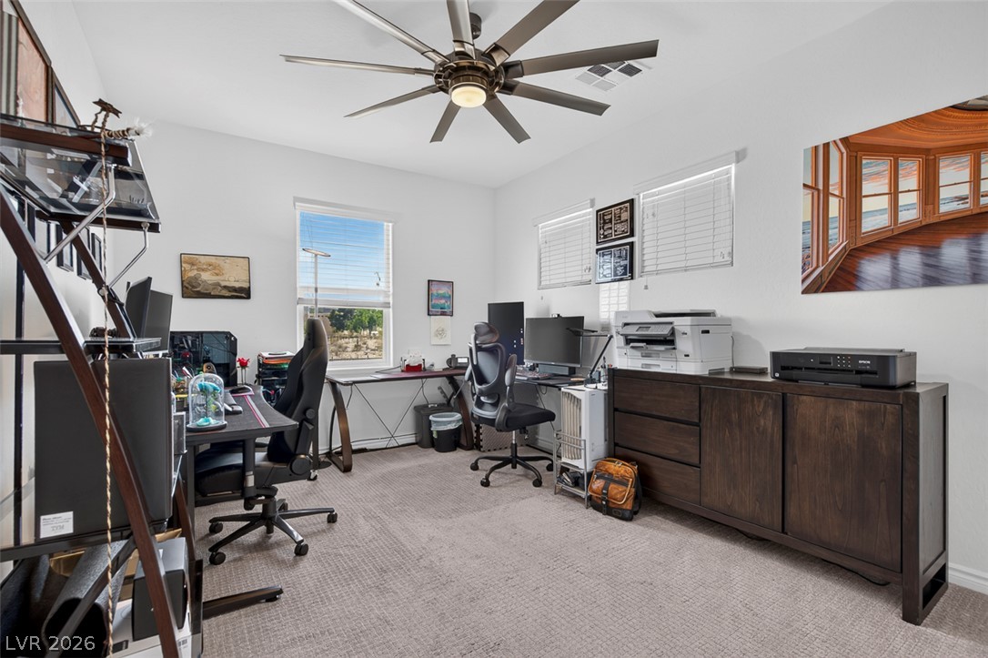 1824 Redland Ridge Street Henderson, NV 89002 - Photo 47 of 69 A well-lit office space offers dedicated areas for work with practical and organized setups.