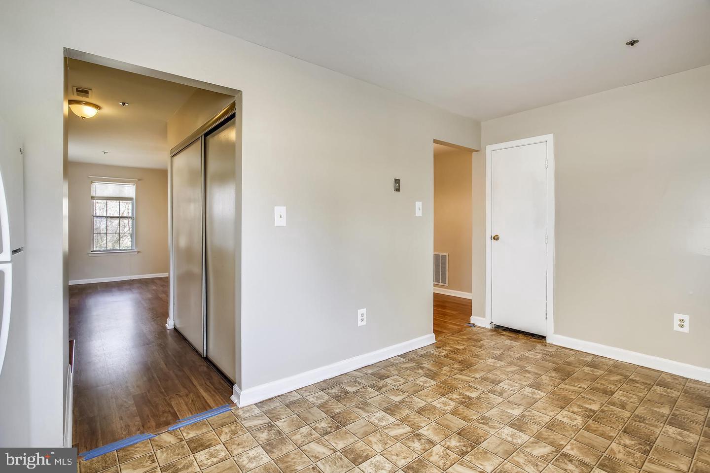 1670 Brooksquare Drive, Unit 54 Capitol Heights, MD 20743 - Photo 11 of 28 a view of a hallway with wooden floor and a bathroom