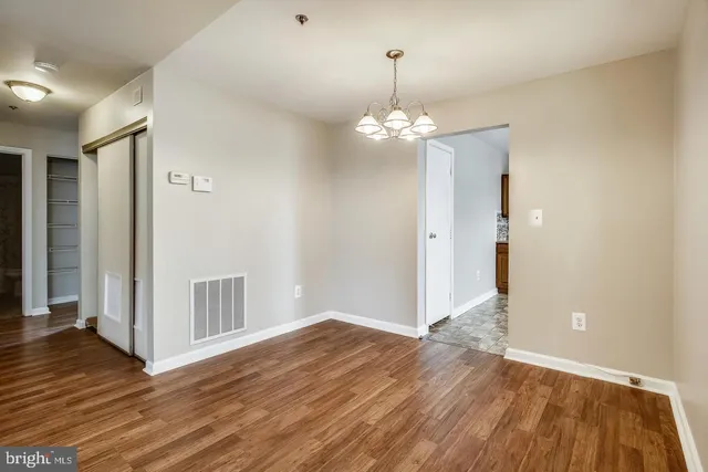a view of a livingroom with wooden floor