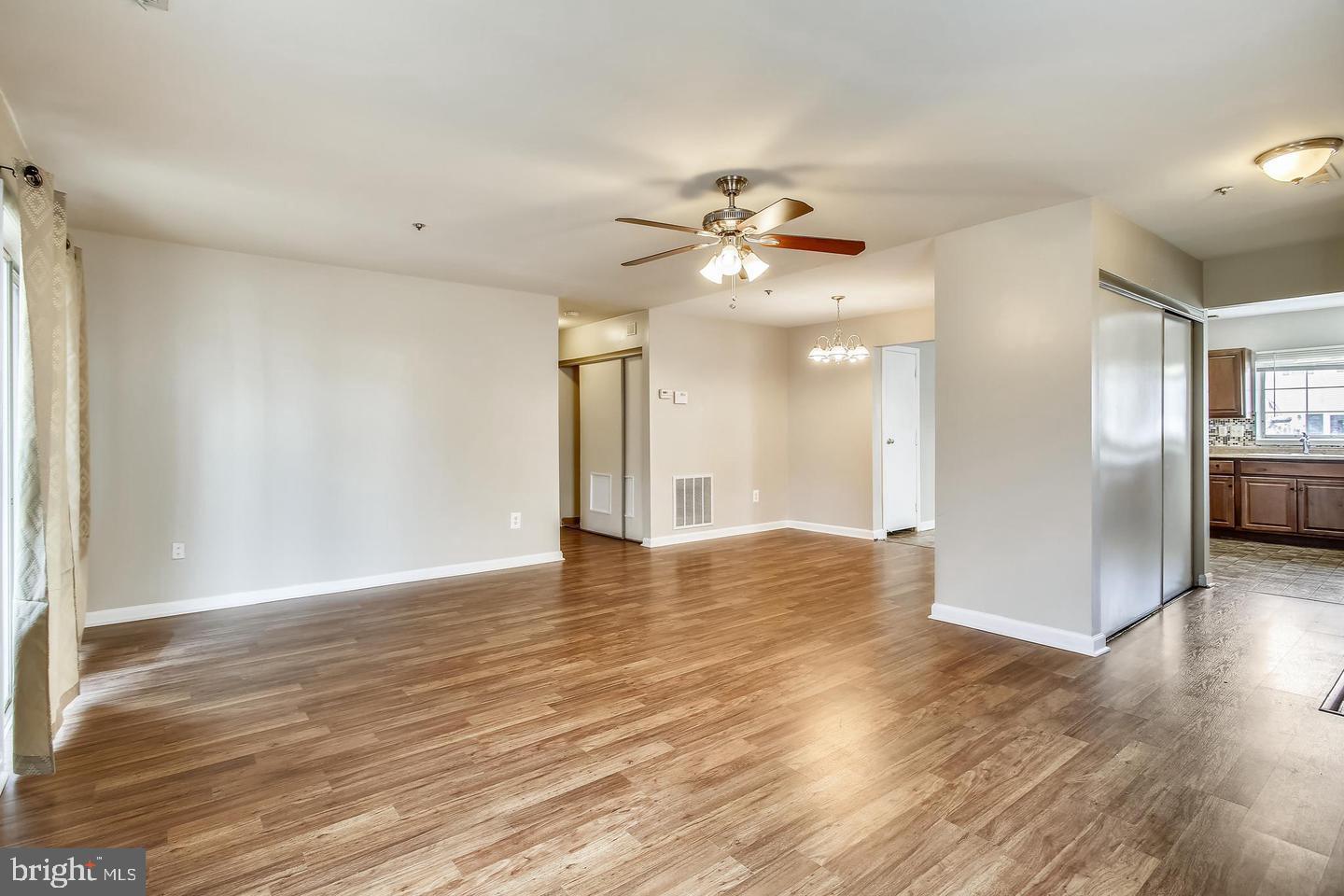 1670 Brooksquare Drive, Unit 54 Capitol Heights, MD 20743 - Photo 5 of 28 a view of an empty room with wooden floor