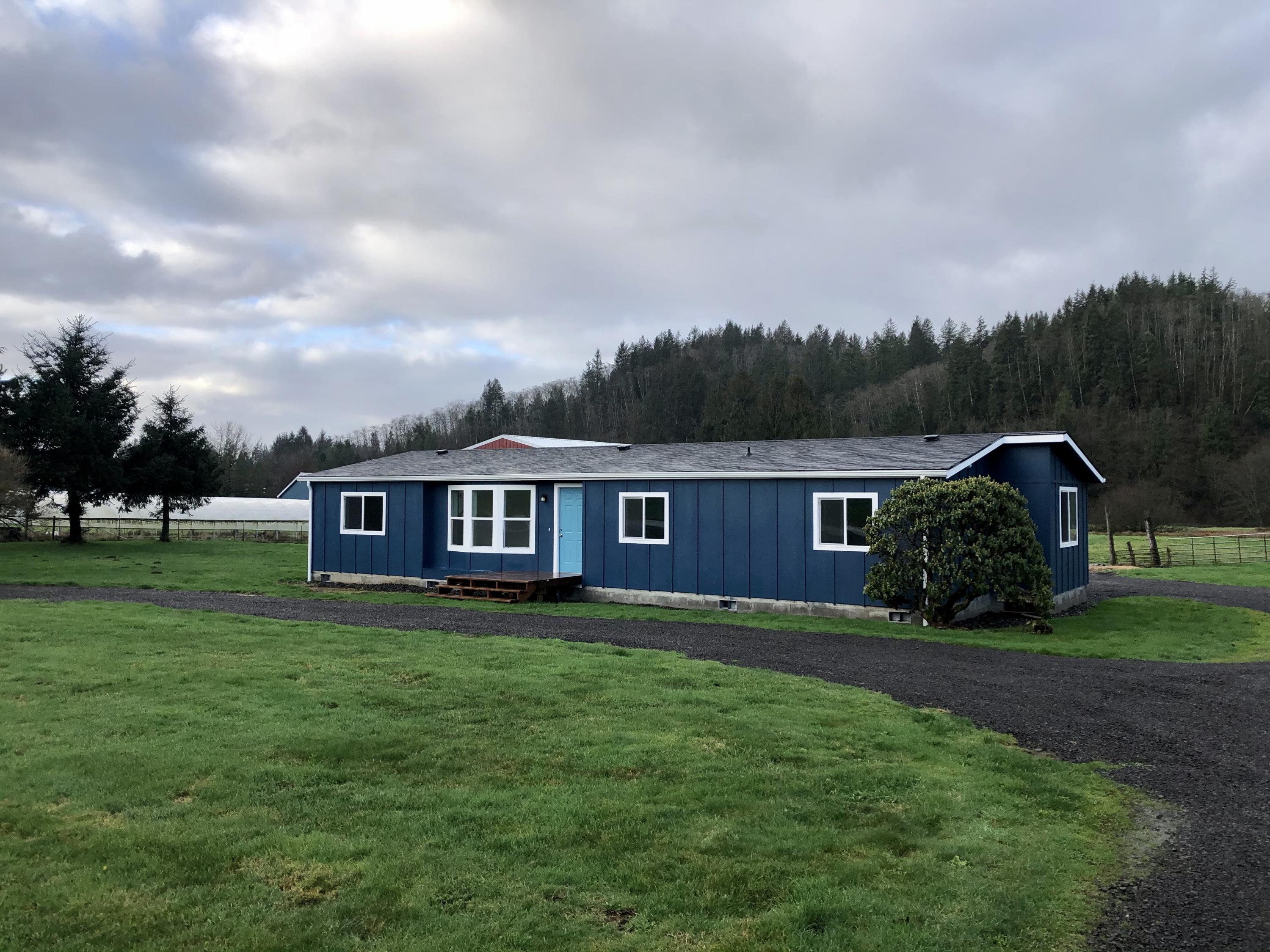 5300 Brickyard Road Tillamook, OR 97141 - Photo 1 of 14 a front view of house with yard and green space