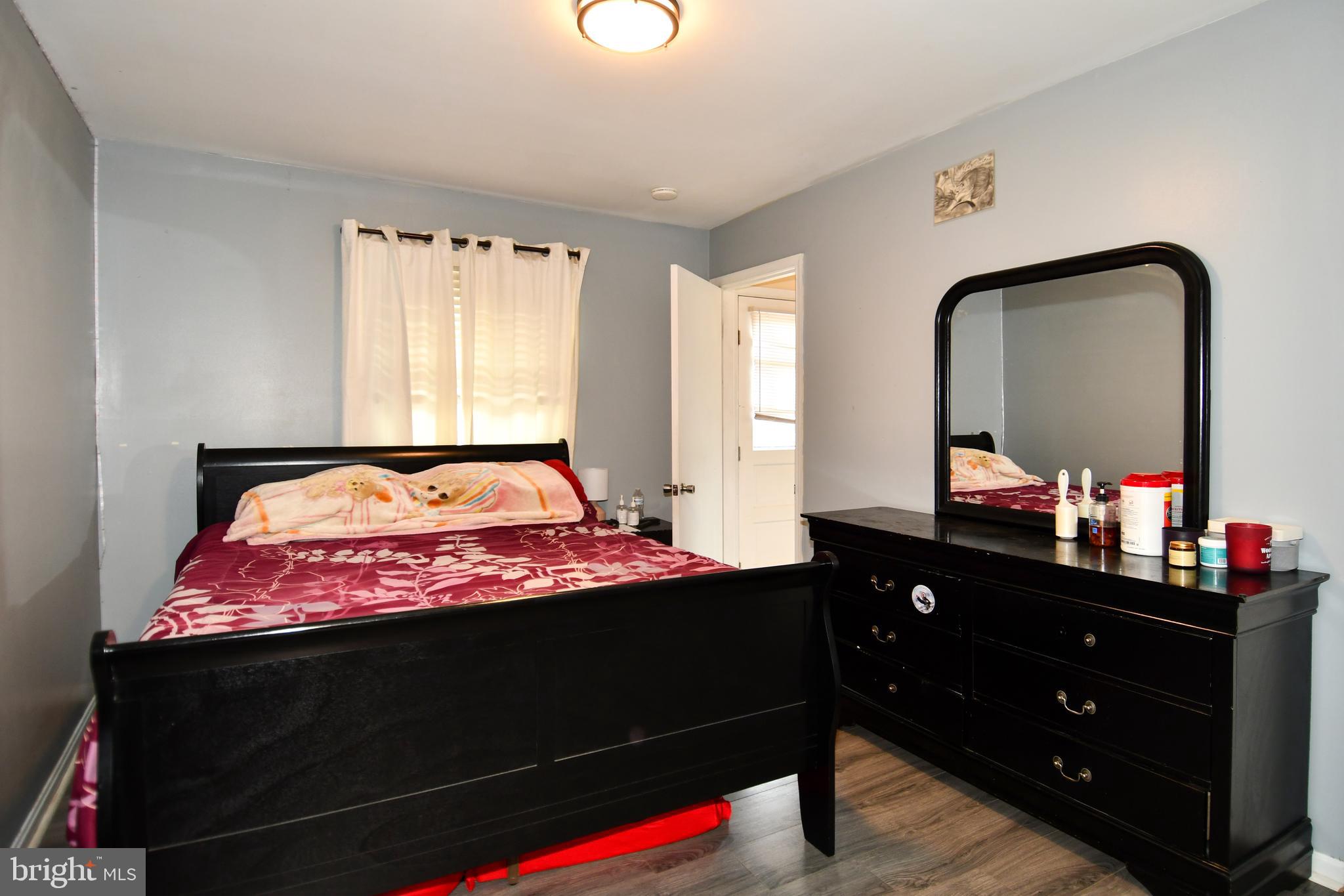 6114 Osborn Road Landover, MD 20785 - Photo 11 of 38 a bedroom with a bed and a dresser