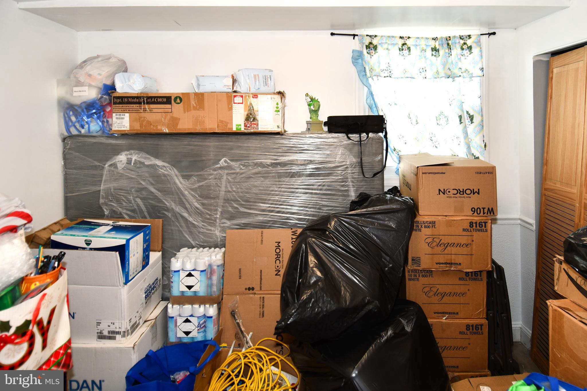 6114 Osborn Road Landover, MD 20785 - Photo 21 of 38 a view of walk in closet with clothes and shoes