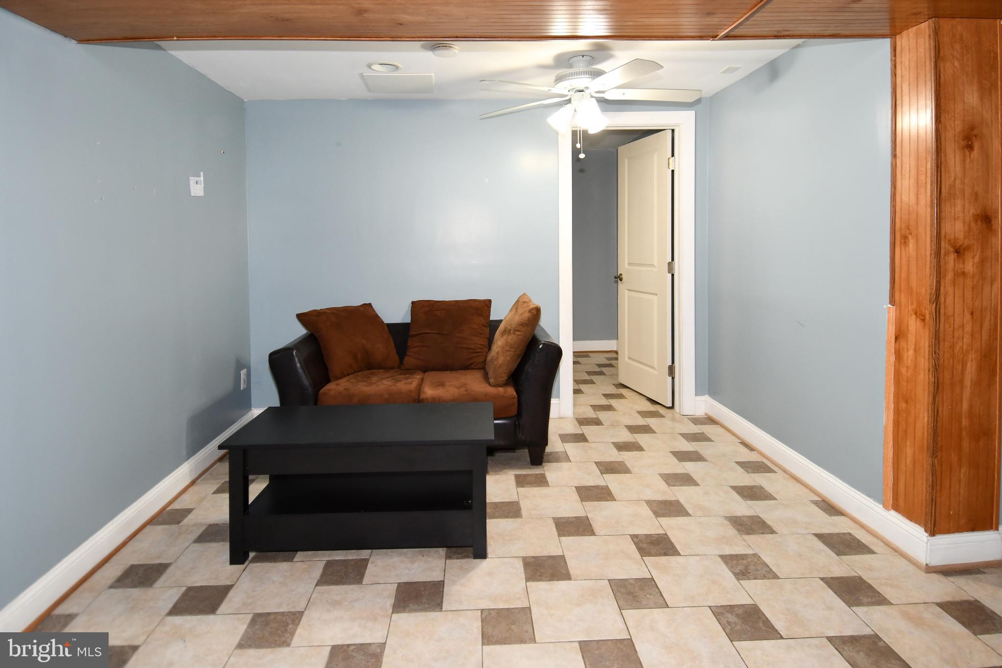 6114 Osborn Road Landover, MD 20785 - Photo 22 of 38 a bedroom with a bed and a chair