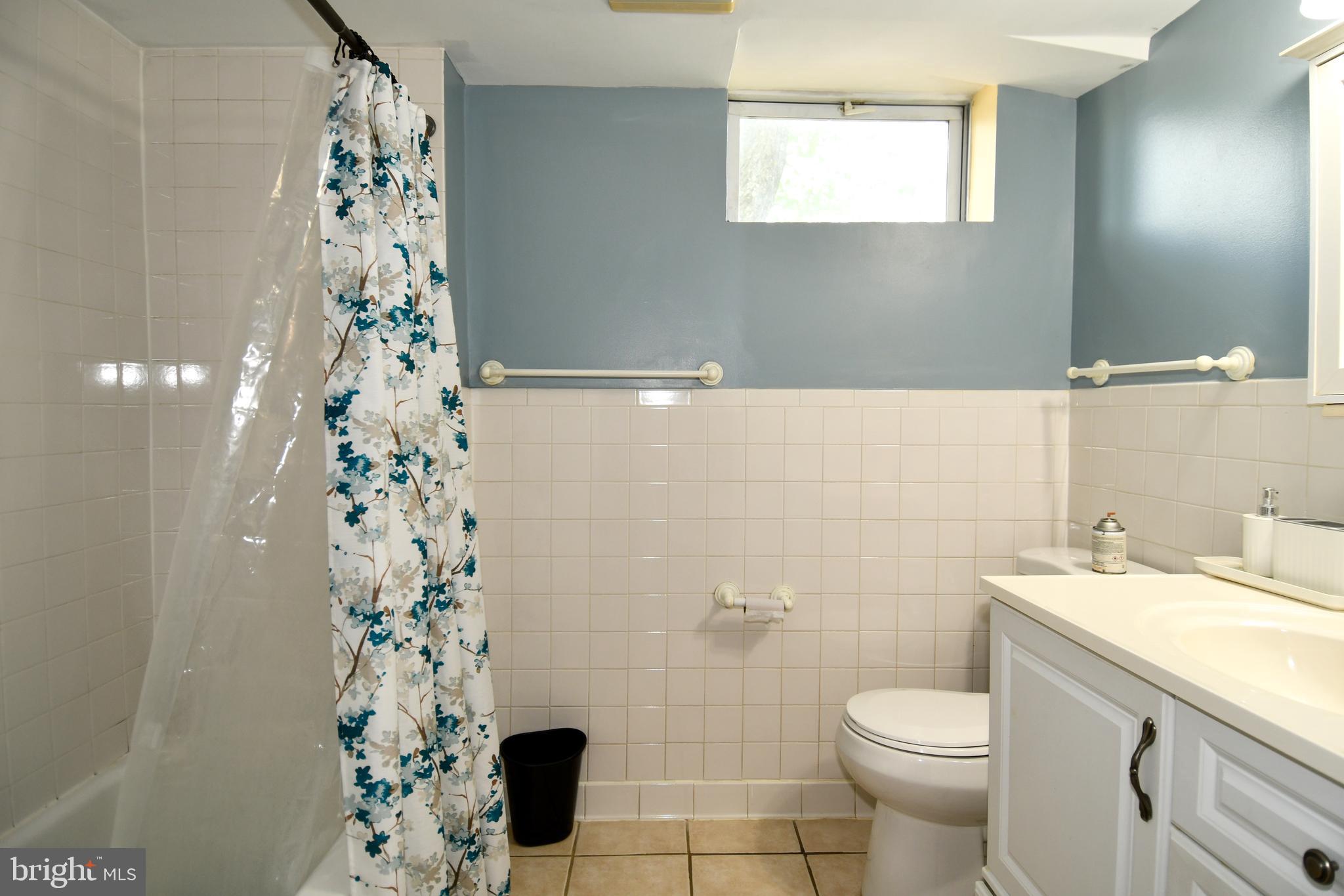 6114 Osborn Road Landover, MD 20785 - Photo 24 of 38 a bathroom with a sink toilet and shower