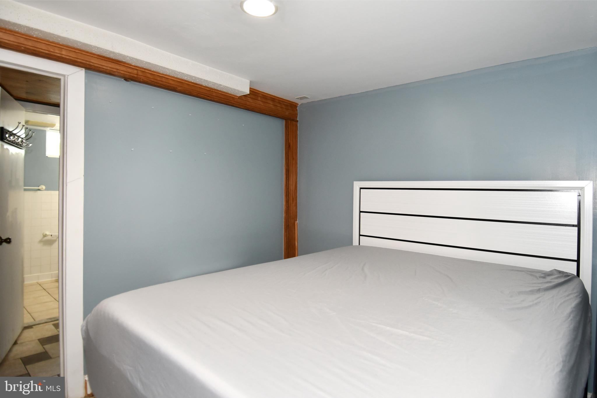 6114 Osborn Road Landover, MD 20785 - Photo 29 of 38 a bed room with a bed and a window