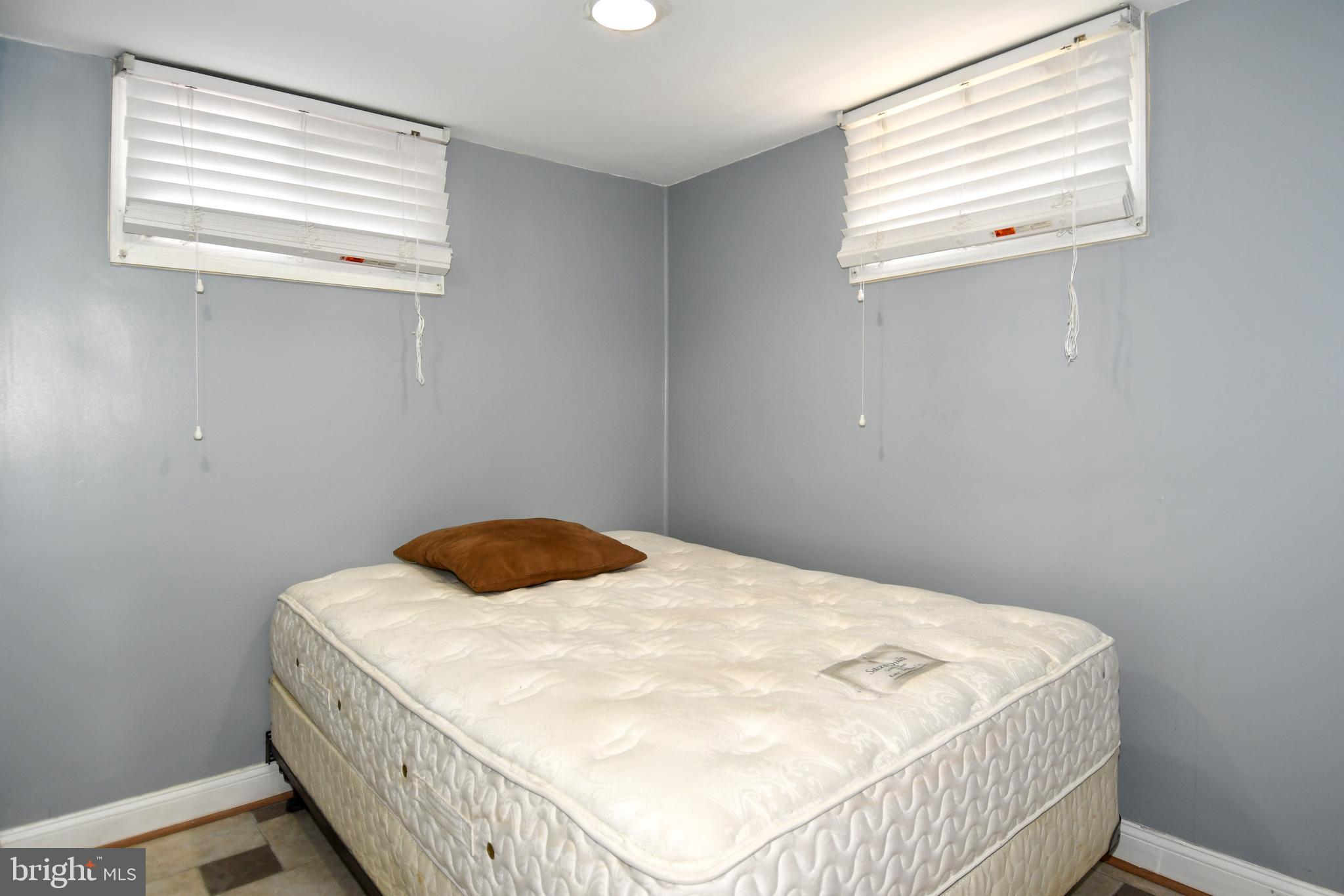 6114 Osborn Road Landover, MD 20785 - Photo 31 of 38 a bedroom with a bed and a window