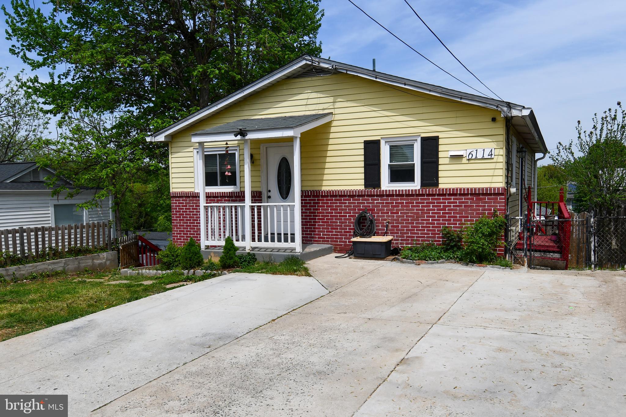 6114 Osborn Road Landover, MD 20785 - Photo 32 of 38 a front view of a house with a yard and outdoor seating