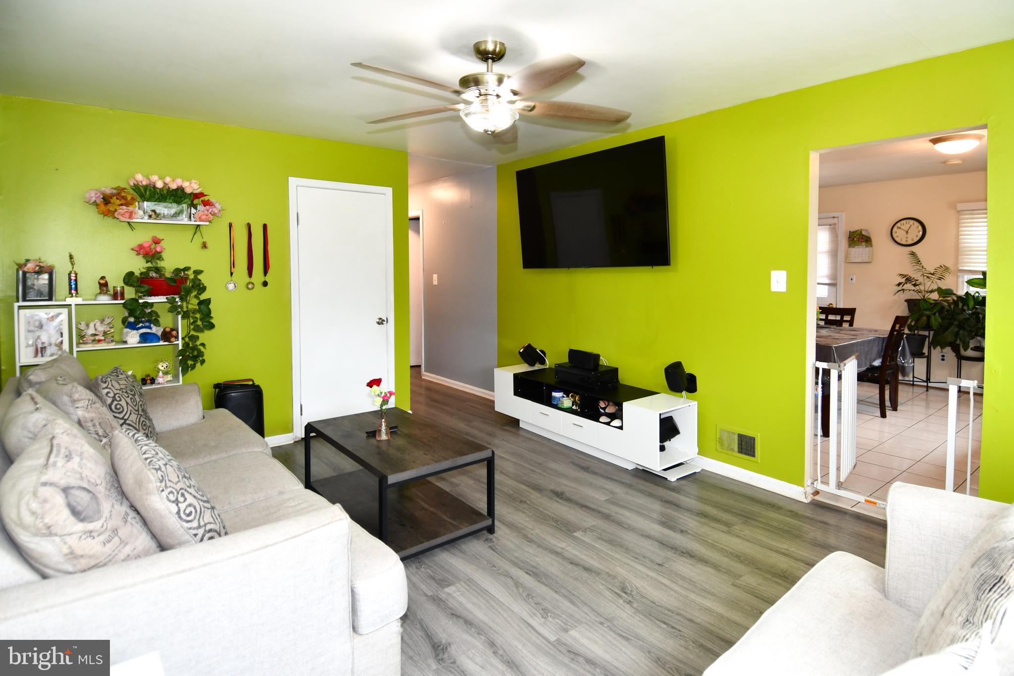 6114 Osborn Road Landover, MD 20785 - Photo 6 of 38 a living room with furniture and a flat screen tv