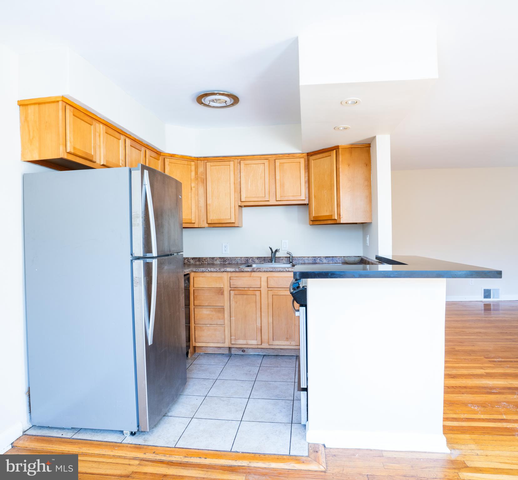 3717 Mimi Circle Philadelphia, PA 19131 - Photo 1 of 12 a kitchen with granite countertop a refrigerator and a sink