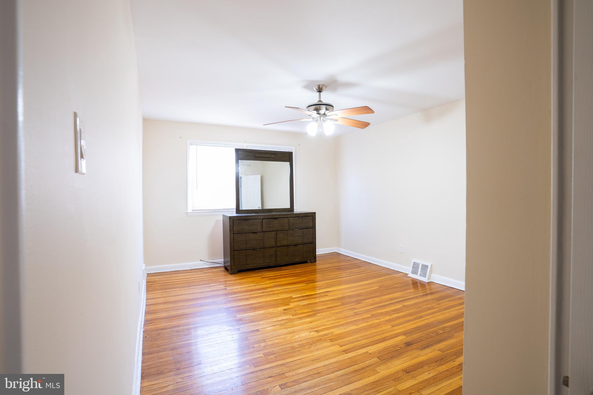 3717 Mimi Circle Philadelphia, PA 19131 - Photo 11 of 12 a room with a bed and a chandelier