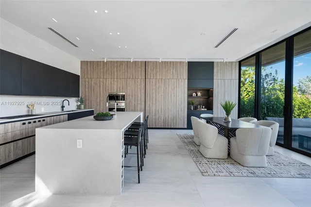 a view of a dining room with furniture and window