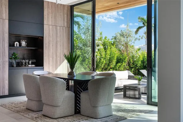 a view of a house with backyard sitting area and garden
