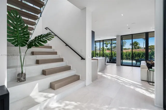 a spacious bedroom with a bed and a large window