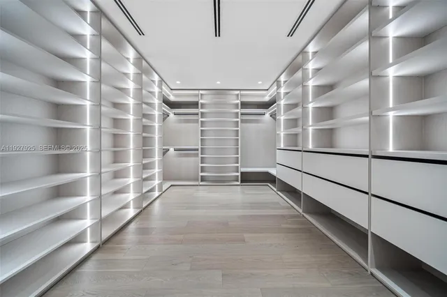 a large bathroom with a large tub and sink