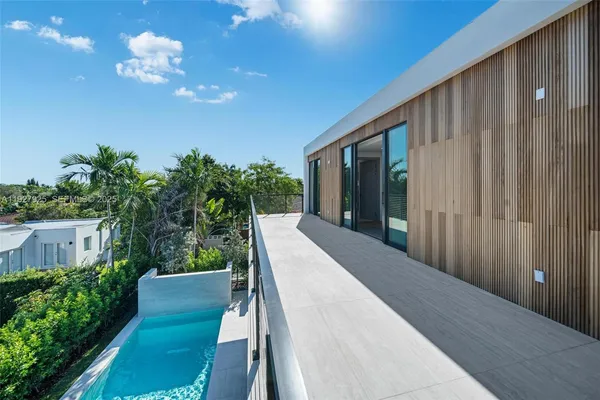 a bathroom with a double vanity sink and a large mirror