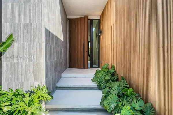 a view of a entryway with flower plants