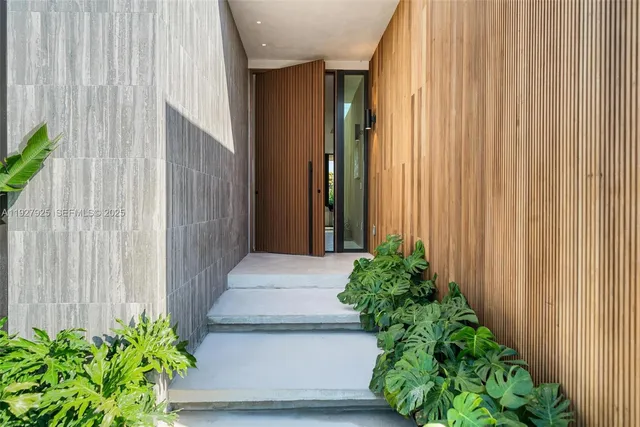 a view of a entryway with flower plants