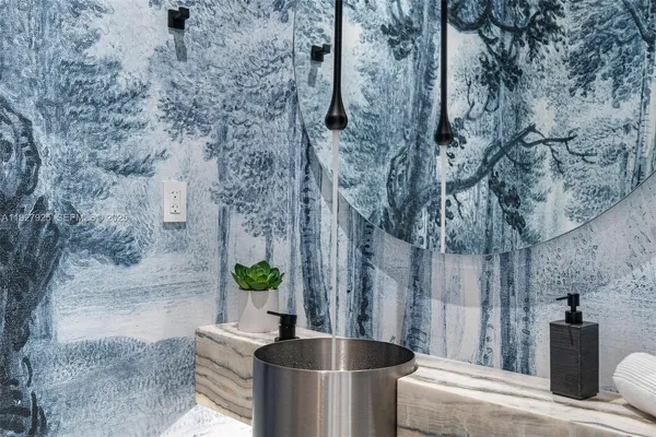 a view of a big room with wooden floor and windows