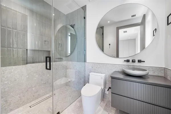 an aerial view of a house with a big yard