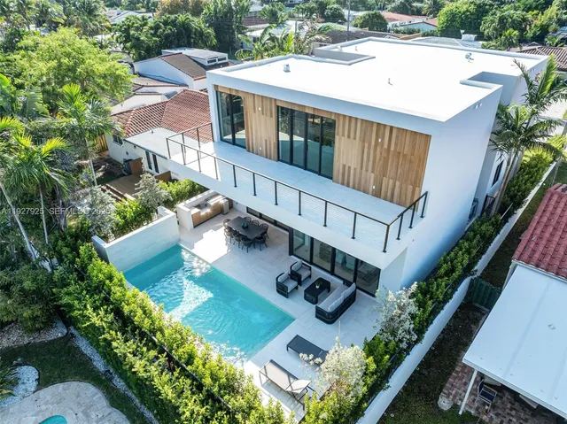 a view of swimming pool outdoor seating and city view