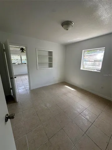 a view of an empty room and window
