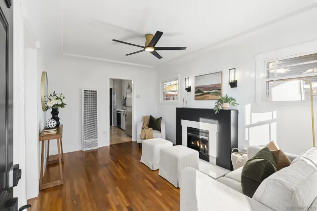 a living room with furniture and a fireplace