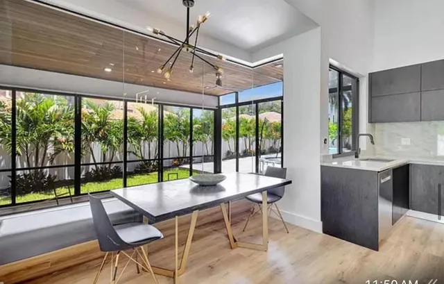 a view of a dining room with furniture window and outside view